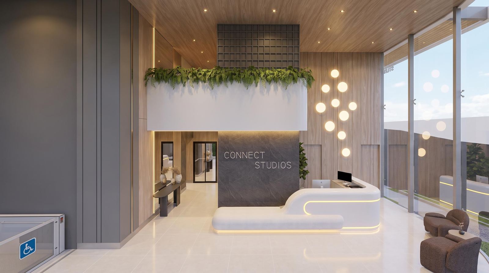 Lobby do Connect Studios, com recepção iluminada e jardim vertical